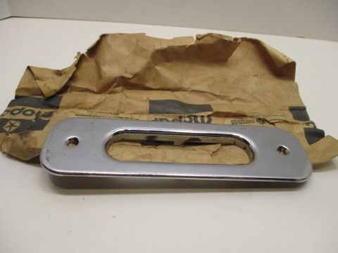 Rear seat latch hole escutcheon