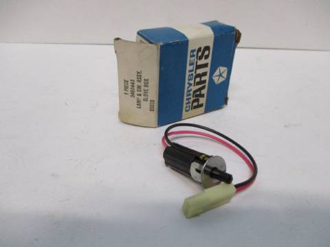 Glove box lamp and switch assembly