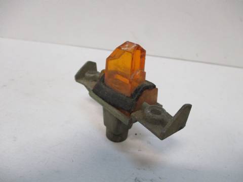 Left turn signal indicator lens and housing