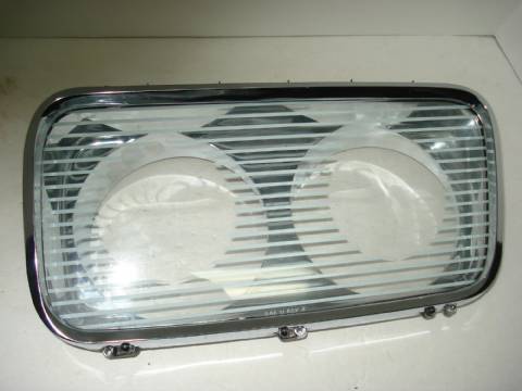 Left headlight bezel with glass