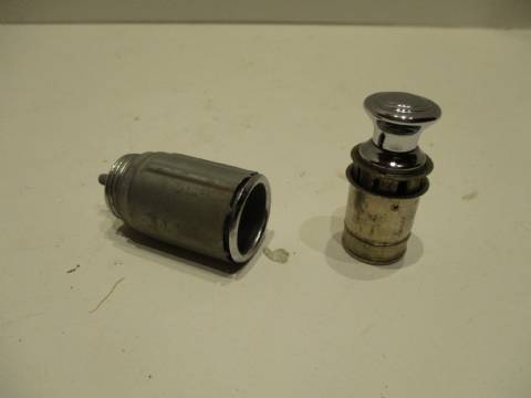 Cigar lighter with receptacle and retainer